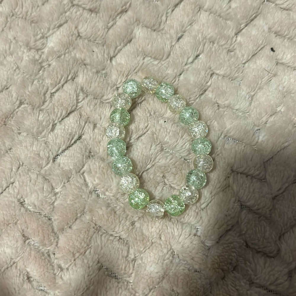 Green and White bracelet, stretchy string. Made by me